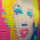 Post it notes stuck to a wall