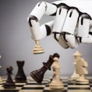 Image of a robotic hand making a chess move